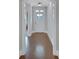 Inviting hallway featuring hardwood floors, white walls, and natural light streaming in at 3538 Serenade Nw Commons, Kennesaw, GA 30152
