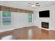 Cozy living room with fireplace, built-in shelving, and backyard access at 3538 Serenade Nw Commons, Kennesaw, GA 30152