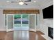 Bright living room with hardwood floors, fireplace and french doors to the outside at 3538 Serenade Nw Commons, Kennesaw, GA 30152