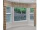 Large bay window with decorative curtains in a living room at 3538 Serenade Nw Commons, Kennesaw, GA 30152