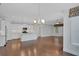 Open concept living space with modern kitchen, and hardwood floors throughout at 3538 Serenade Nw Commons, Kennesaw, GA 30152