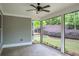 Charming screened-in porch with view of landscaped backyard and beautiful plantings at 3538 Serenade Nw Commons, Kennesaw, GA 30152