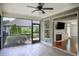 Inviting screened-in porch with ceiling fan, fireplace, and lovely views of the manicured garden at 3538 Serenade Nw Commons, Kennesaw, GA 30152