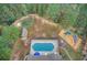 Aerial view of community amenities featuring a pool, playground, putting green and picnic pavilion at 401 Night Hawk Ct, Canton, GA 30114