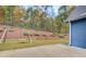 Spacious backyard features a concrete patio and a swing set at 401 Night Hawk Ct, Canton, GA 30114