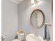 Half bathroom features a modern sink and a decorative mirror at 401 Night Hawk Ct, Canton, GA 30114