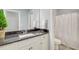 Bathroom with sink and black granite countertops, and shower with white curtain at 401 Night Hawk Ct, Canton, GA 30114