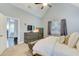 Comfortable bedroom with carpet flooring and view to an adjacent living room at 401 Night Hawk Ct, Canton, GA 30114