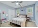 Cozy bedroom with a bed, two windows, and a ceiling fan at 401 Night Hawk Ct, Canton, GA 30114