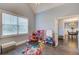 Bedroom includes fun decor and access to the dining room at 401 Night Hawk Ct, Canton, GA 30114
