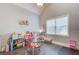 Bright playroom area with fun decor and great natural light from the large window at 401 Night Hawk Ct, Canton, GA 30114