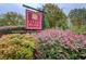 A beautiful neighborhood sign surrounded by colorful bushes and mature landscaping at 401 Night Hawk Ct, Canton, GA 30114