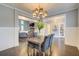 Cozy dining room with sophisticated chandelier and access to other rooms at 401 Night Hawk Ct, Canton, GA 30114