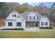 Beautiful single-Gathering home boasting a manicured lawn, stone accents, and a welcoming covered porch at 401 Night Hawk Ct, Canton, GA 30114