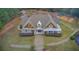 Beautifully landscaped home featuring a well-manicured lawn and inviting walkway leading to the front entrance at 401 Night Hawk Ct, Canton, GA 30114