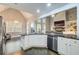 Open-concept kitchen with island, stainless steel appliances, and view into the living room at 401 Night Hawk Ct, Canton, GA 30114