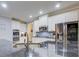 Modern kitchen featuring granite countertops, stainless steel appliances, and white cabinets at 401 Night Hawk Ct, Canton, GA 30114