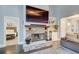 Cozy living room featuring a stone fireplace with wooden mantel, and view to the main bedroom at 401 Night Hawk Ct, Canton, GA 30114