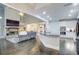 Open living space with kitchen, fireplace, hardwood floors, and neutral décor at 401 Night Hawk Ct, Canton, GA 30114