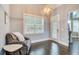 Cozy sitting area with hardwood floors, neutral colors, and lots of natural light at 401 Night Hawk Ct, Canton, GA 30114