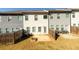 Backyard view of townhomes with patios and fencing at 4940 Elm Brook Dr, Atlanta, GA 30349