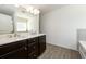 Bathroom offers a double sink vanity with modern fixtures and a large mirror at 4940 Elm Brook Dr, Atlanta, GA 30349