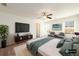 Bedroom features neutral decor, a ceiling fan, and a flat screen television at 4940 Elm Brook Dr, Atlanta, GA 30349