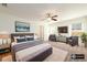 Cozy bedroom featuring a ceiling fan, television, and sitting area with comfortable chairs at 4940 Elm Brook Dr, Atlanta, GA 30349