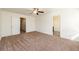 Unfurnished bedroom offers a neutral color palette and two entry doors at 4940 Elm Brook Dr, Atlanta, GA 30349