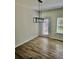 Bright dining area with modern light fixture and hardwood floors, perfect for gatherings at 4940 Elm Brook Dr, Atlanta, GA 30349
