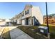 Exterior view of townhomes with modern siding and well-maintained lawns under a clear sky at 4940 Elm Brook Dr, Atlanta, GA 30349