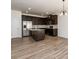 Modern kitchen featuring dark cabinetry, stainless steel appliances, and an island at 4940 Elm Brook Dr, Atlanta, GA 30349