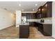 Well-equipped kitchen with dark cabinetry, granite countertops, and stainless steel appliances at 4940 Elm Brook Dr, Atlanta, GA 30349