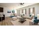 Bright, open-concept living and dining area with hardwood floors and neutral decor at 4940 Elm Brook Dr, Atlanta, GA 30349