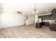 Spacious living area with hardwood flooring leading to a staircase and modern kitchen at 4940 Elm Brook Dr, Atlanta, GA 30349