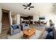Comfortable living room open to dining and kitchen, with modern furnishings and ceiling fan at 4940 Elm Brook Dr, Atlanta, GA 30349