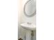 Cozy half bath featuring a pedestal sink and modern fixtures at 4940 Elm Brook Dr, Atlanta, GA 30349
