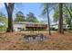 A spacious backyard with a fire pit, rock seating, and multi-level deck provide ample outdoor space at 1155 Moores Mill Nw Rd, Atlanta, GA 30327