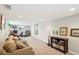 Finished basement area with a sofa, bookshelf, and artwork on the walls at 1155 Moores Mill Nw Rd, Atlanta, GA 30327