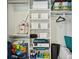 Organized closet featuring shelves, storage containers, and hanging space at 1155 Moores Mill Nw Rd, Atlanta, GA 30327