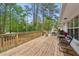 Expansive wooden deck with outdoor seating and views of the wooded backyard at 1155 Moores Mill Nw Rd, Atlanta, GA 30327