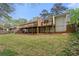 Exterior view of a home featuring a multi-level deck, perfect for outdoor living and entertaining at 1155 Moores Mill Nw Rd, Atlanta, GA 30327