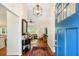 Welcoming foyer with hardwood floors, elegant lighting, and a glimpse of the living room at 1155 Moores Mill Nw Rd, Atlanta, GA 30327
