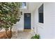 Inviting entryway featuring a stylish blue front door, potted plants, and brick accents at 1155 Moores Mill Nw Rd, Atlanta, GA 30327