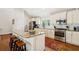 Well-equipped kitchen with granite countertops, stainless steel appliances, and bright lighting at 1155 Moores Mill Nw Rd, Atlanta, GA 30327