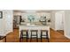 Charming kitchen featuring an island with barstool seating and stainless steel appliances at 1155 Moores Mill Nw Rd, Atlanta, GA 30327