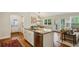 Spacious kitchen island with stainless steel dishwasher and view to living area at 1155 Moores Mill Nw Rd, Atlanta, GA 30327