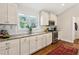 Bright kitchen featuring white cabinets, granite countertops, and stainless steel appliances at 1155 Moores Mill Nw Rd, Atlanta, GA 30327