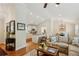 Open-concept living room and kitchen featuring hardwood floors and plenty of natural light at 1155 Moores Mill Nw Rd, Atlanta, GA 30327