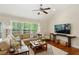 Bright and airy living room with hardwood floors, large windows, and stylish decor at 1155 Moores Mill Nw Rd, Atlanta, GA 30327